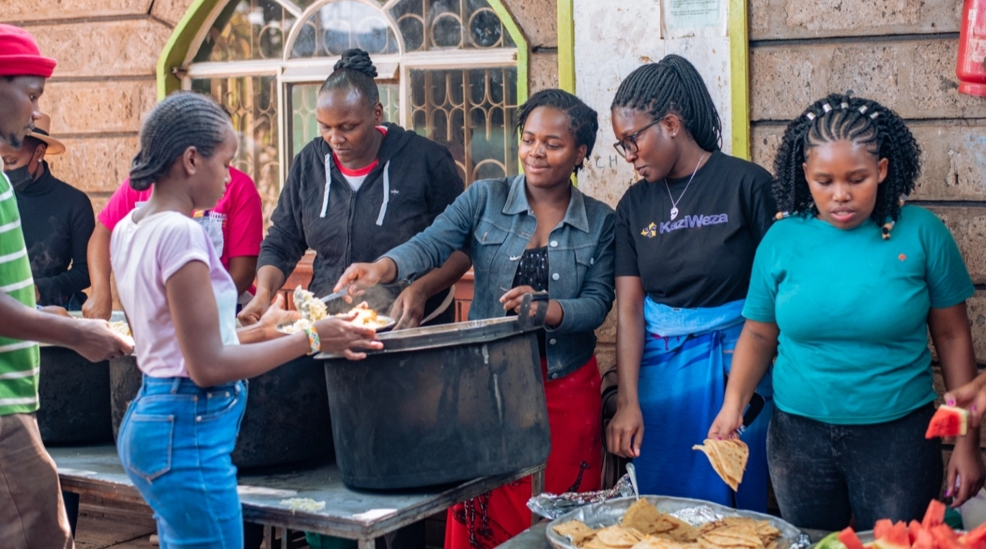 Hands lifting a sack together